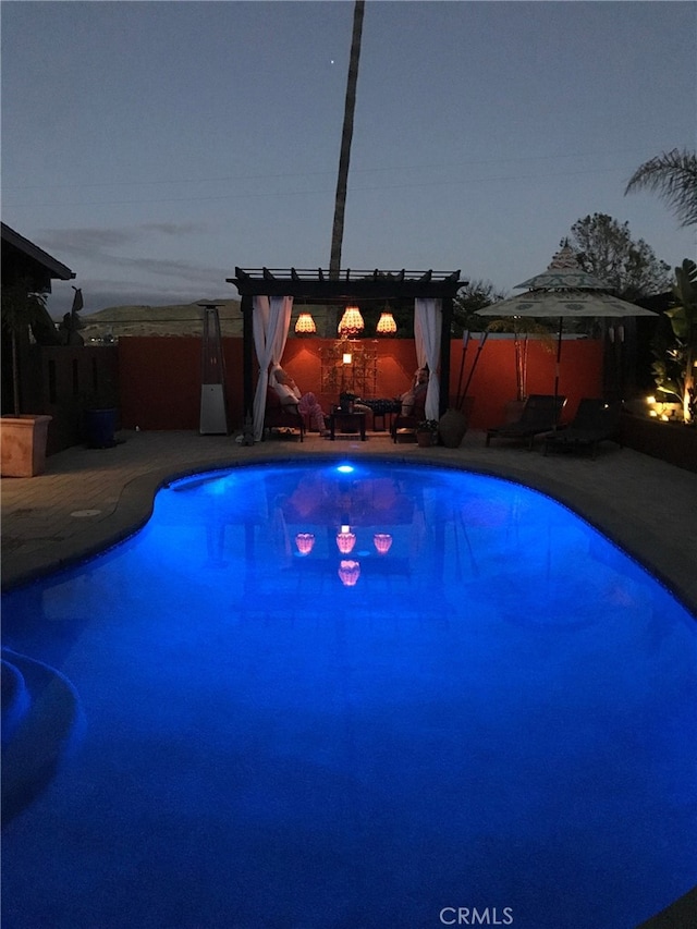 view of swimming pool with a fenced in pool, a pergola, and a patio