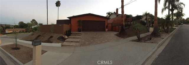 view of front of property with decorative driveway