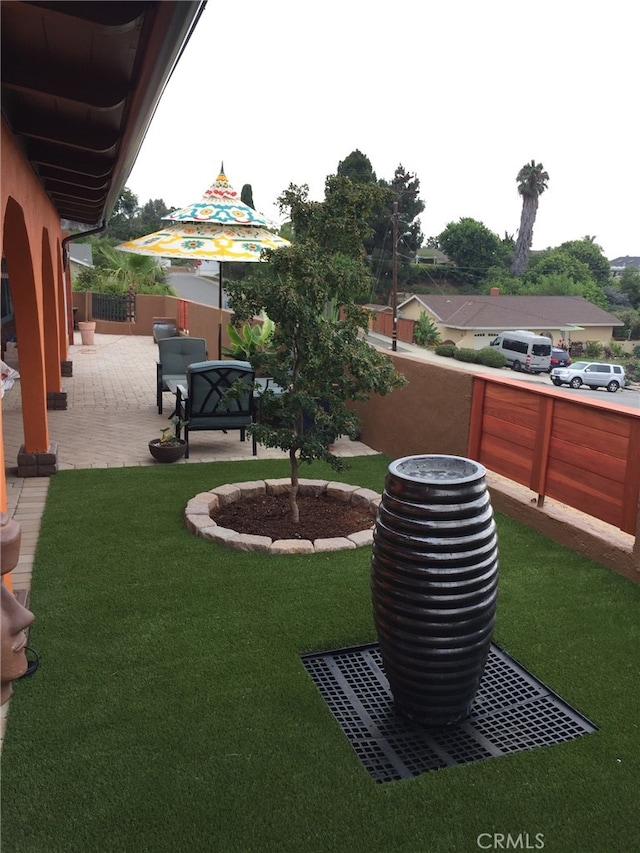 view of yard with a patio and fence