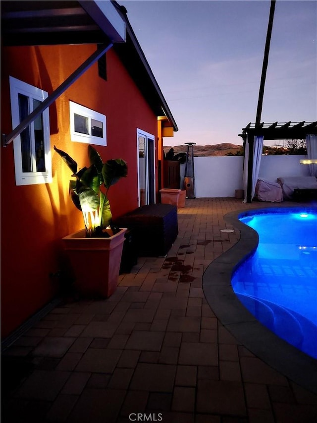 view of patio / terrace with a fenced in pool