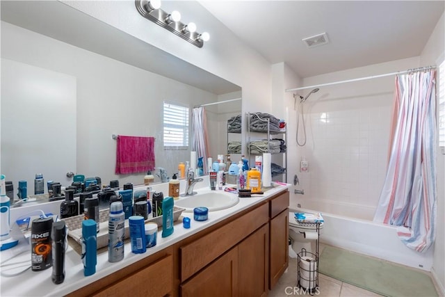 bathroom featuring vanity, shower / bathtub combination with curtain, and tile patterned flooring