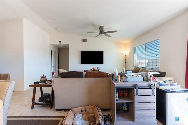 living room featuring vaulted ceiling and ceiling fan