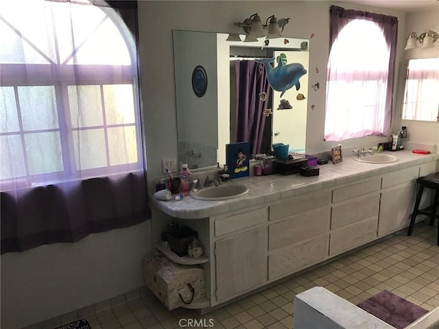 4645 Ledge Ave, Toluca Lake, CA 91602 - bathroom featuring tile patterned flooring and double vanity