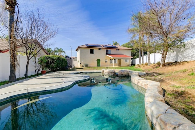 view of swimming pool with a fenced in pool and a fenced backyard