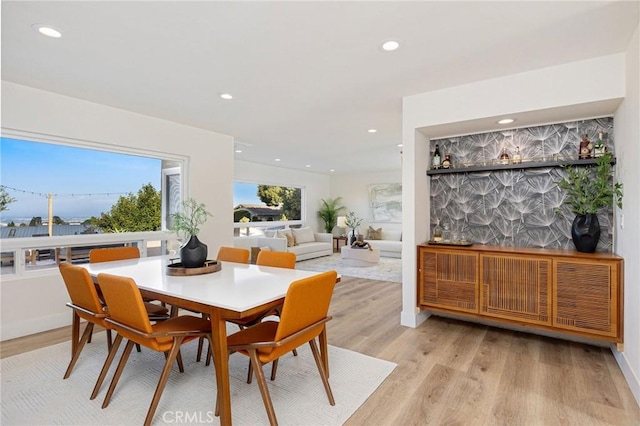 dining area featuring light wood-type flooring