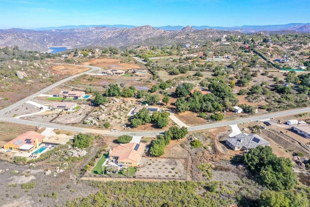 birds eye view of property with a mountain view