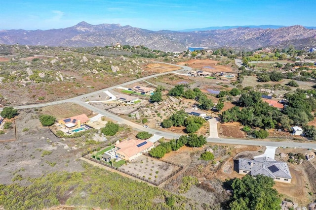 birds eye view of property featuring a mountain view