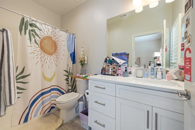 bathroom with vanity and toilet