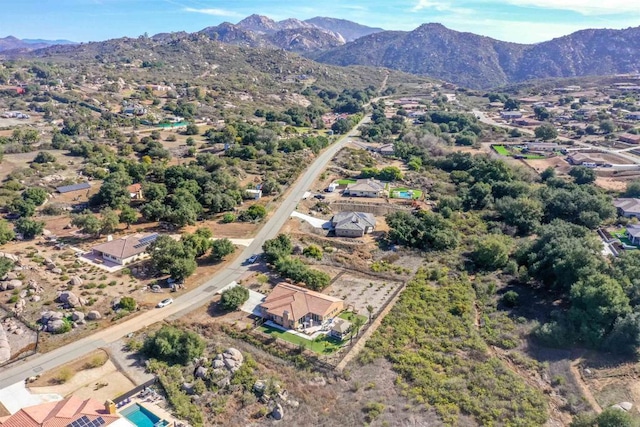 birds eye view of property with a mountain view