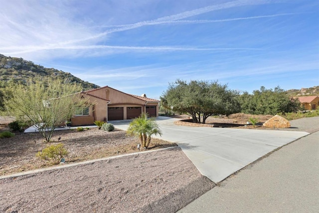 ranch-style house featuring a garage