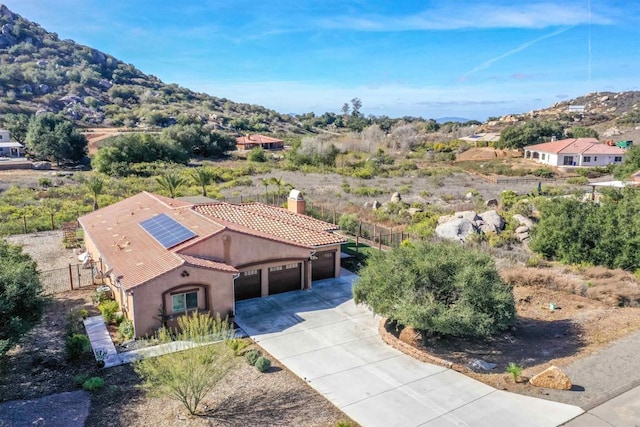 birds eye view of property with a mountain view