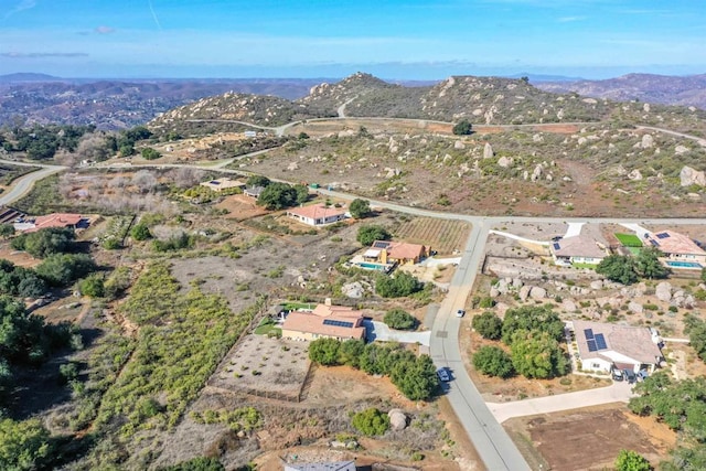 drone / aerial view featuring a mountain view