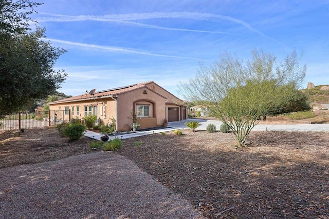 view of front of property with a garage