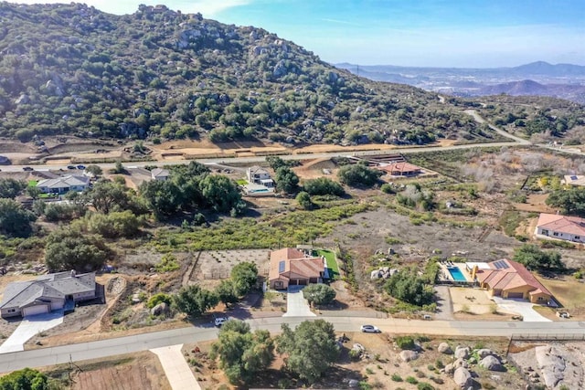 birds eye view of property with a mountain view