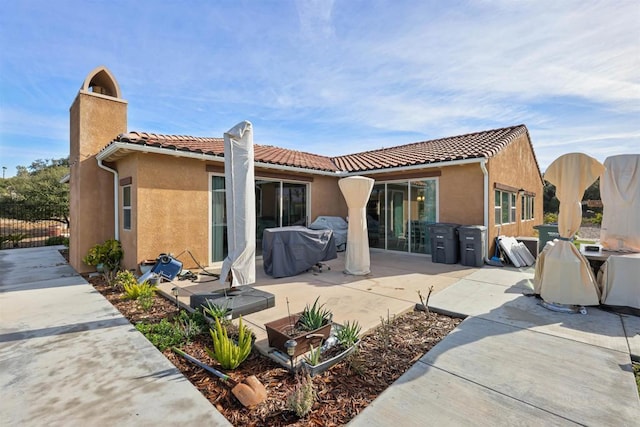 rear view of property with a patio area