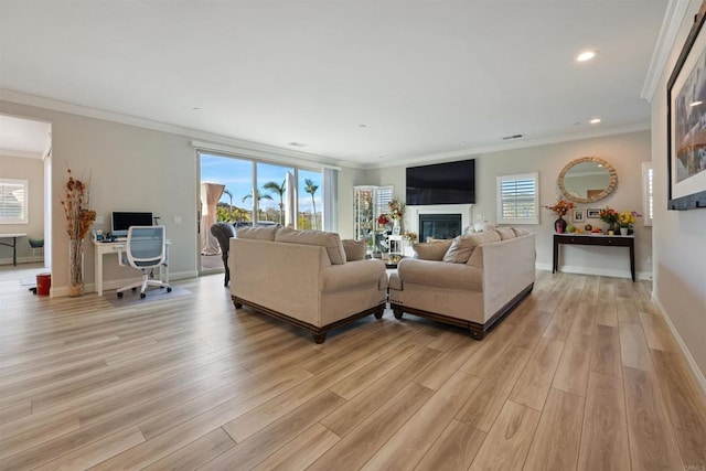 living room featuring ornamental molding and light hardwood / wood-style floors