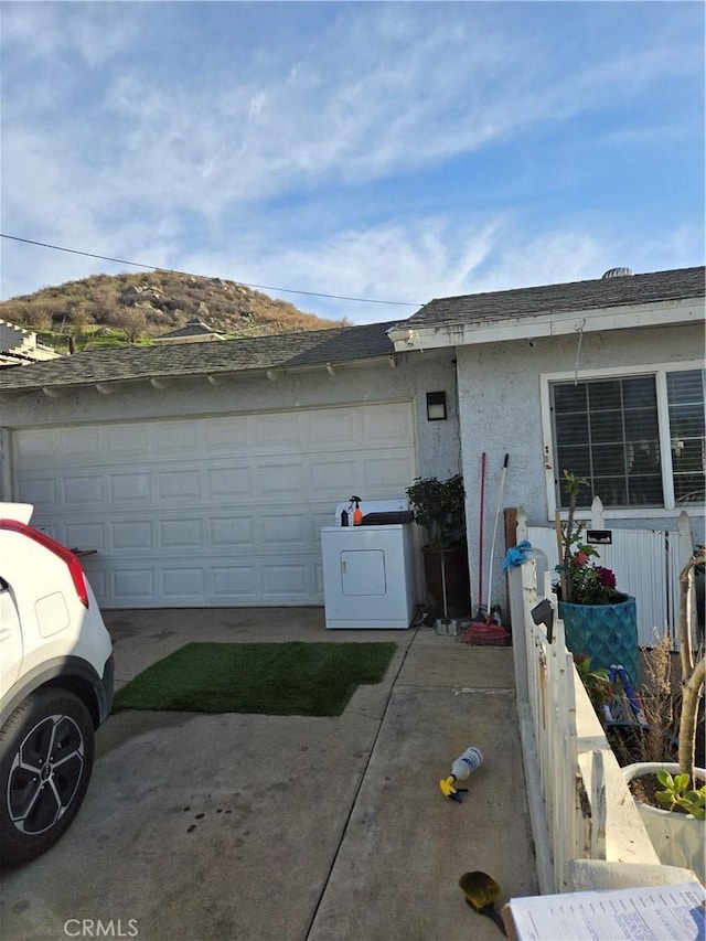 view of front facade featuring washer / dryer