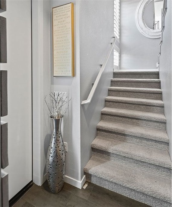 stairs featuring hardwood / wood-style flooring