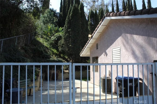 exterior space with fence and central air condition unit