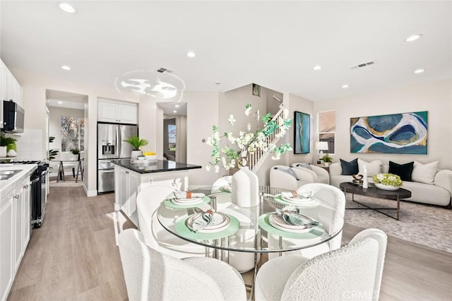 dining area with light hardwood / wood-style floors