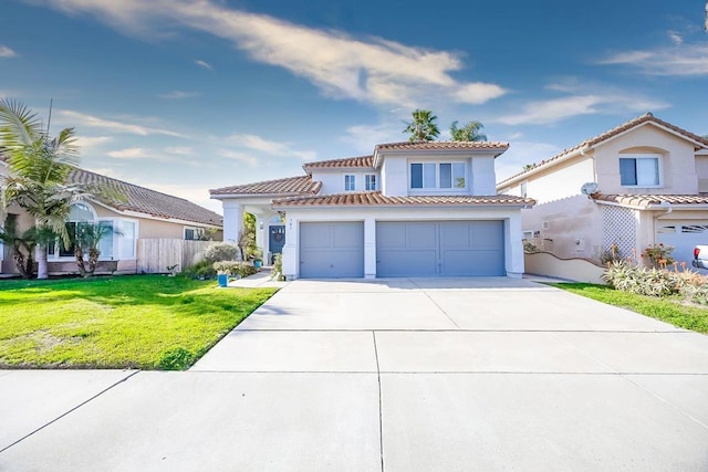 mediterranean / spanish home with a front lawn and a garage