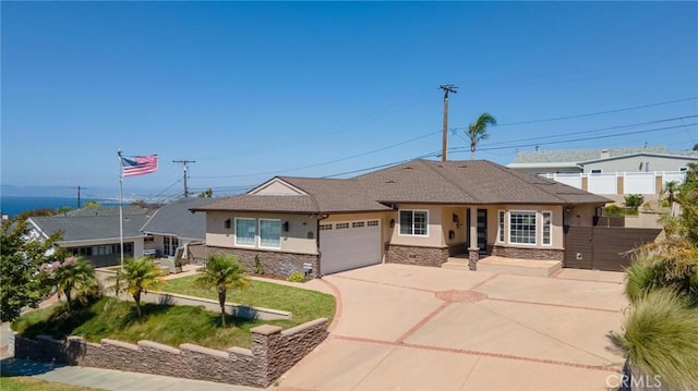 view of front facade with a garage and a front yard