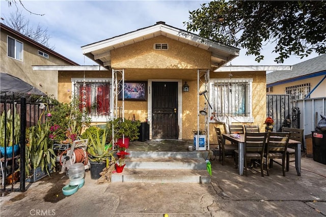 view of front of home with a patio