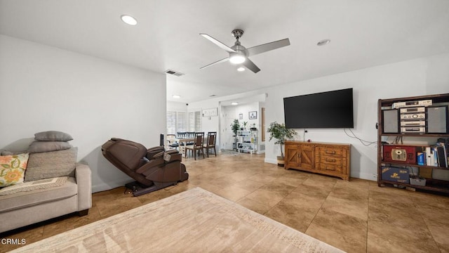 living room featuring baseboards, recessed lighting, visible vents, and a ceiling fan