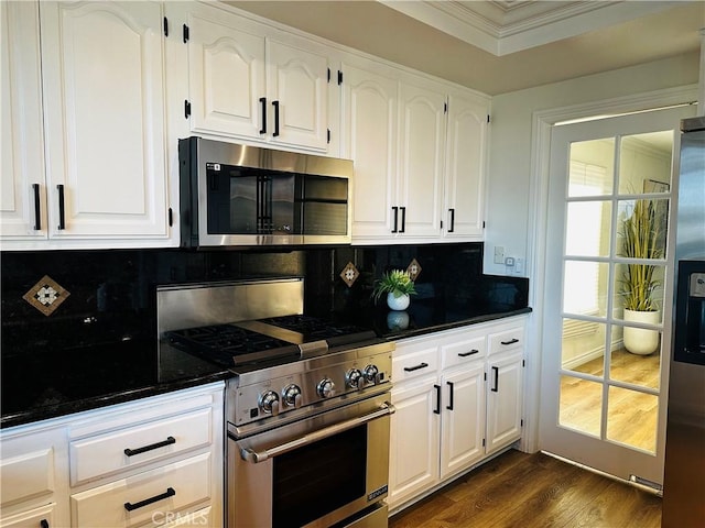 2120 E White Lantern Ln, Orange, CA 92867 - kitchen with stainless steel appliances, dark countertops, dark wood-style flooring, white cabinets, and crown molding