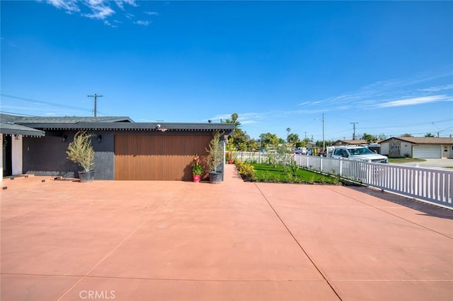 view of patio / terrace featuring fence