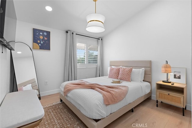 bedroom featuring light wood-type flooring, baseboards, and recessed lighting