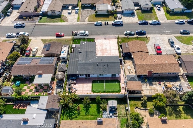 birds eye view of property with a residential view