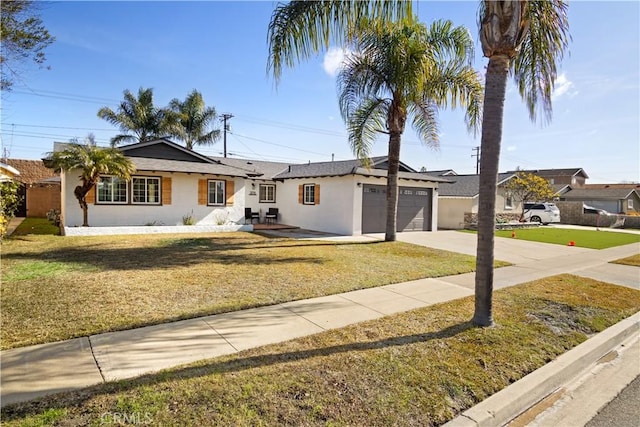 ranch-style home featuring stucco siding, a front lawn, a garage, and driveway