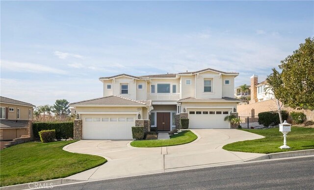 view of front of house with a front yard and a garage