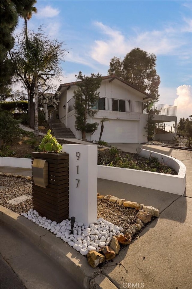 view of front of home featuring stairs