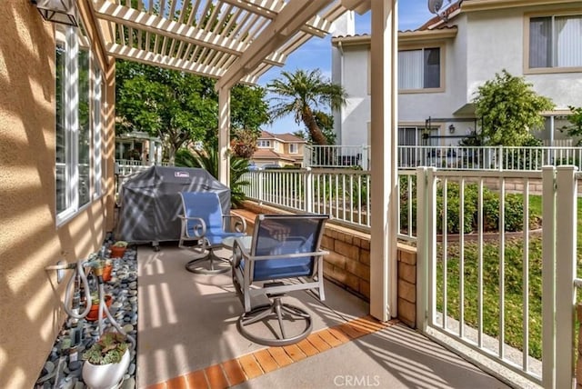 exterior space with grilling area, fence, and a pergola