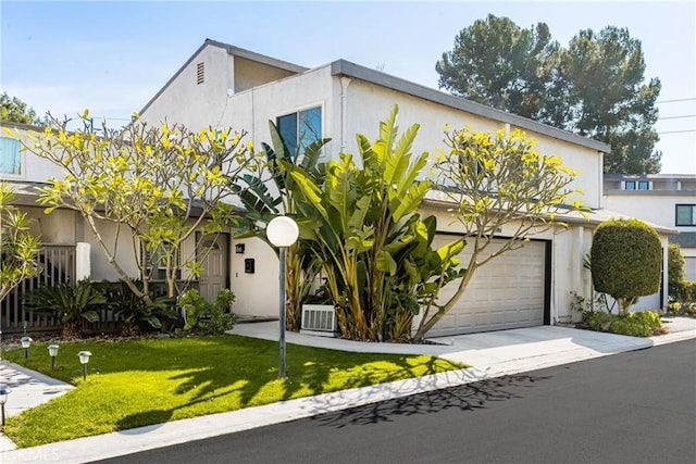 view of front facade featuring a garage and a front yard