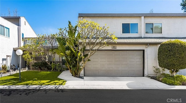 view of front of house with a front yard and a garage