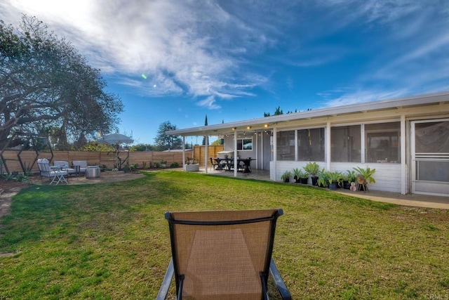 exterior space with a patio and a sunroom