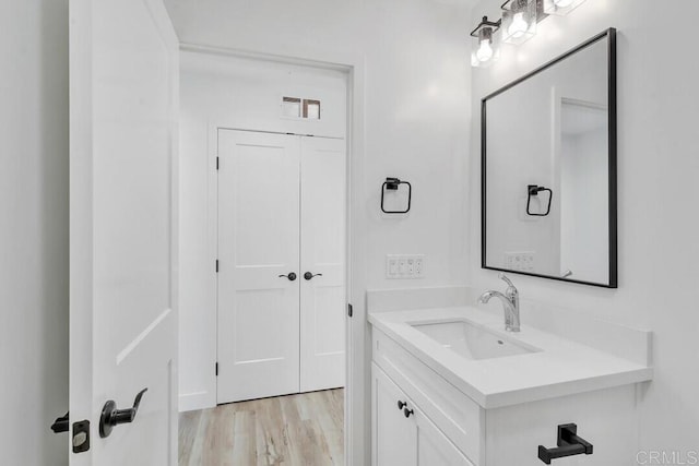 bathroom with vanity and wood-type flooring