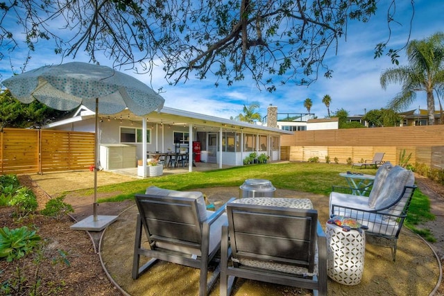 exterior space with a yard, a patio, and a sunroom