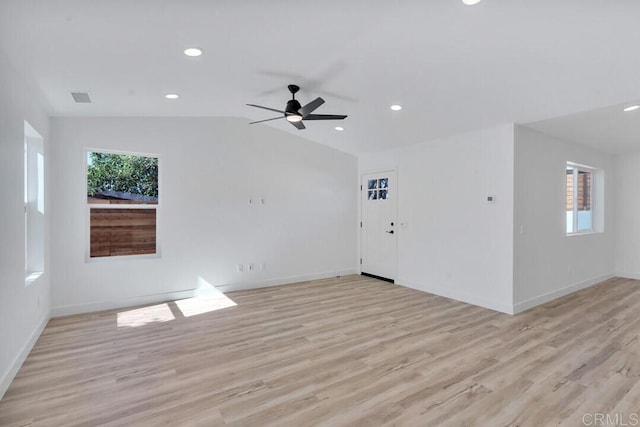 unfurnished living room with light wood-type flooring, lofted ceiling, and ceiling fan