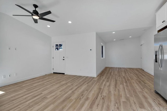 unfurnished living room with ceiling fan and light hardwood / wood-style flooring