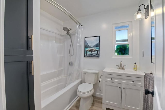 full bathroom featuring shower / tub combo with curtain, vanity, toilet, and hardwood / wood-style flooring