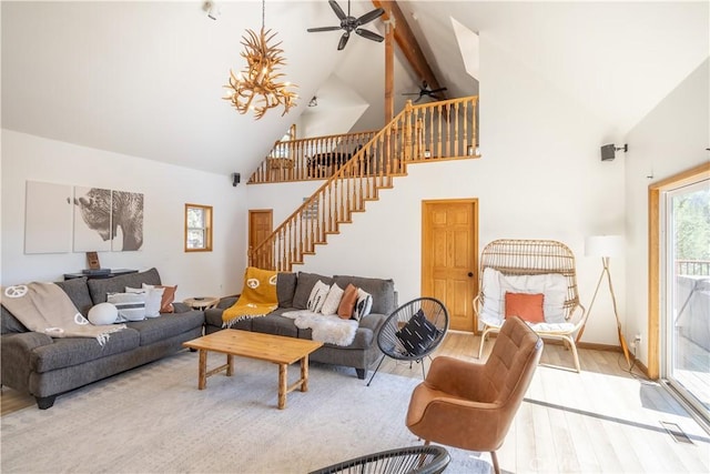 188 S Finch Dr, Big Bear Lake, CA 92315 - living area featuring a ceiling fan, high vaulted ceiling, wood finished floors, stairway, and beam ceiling