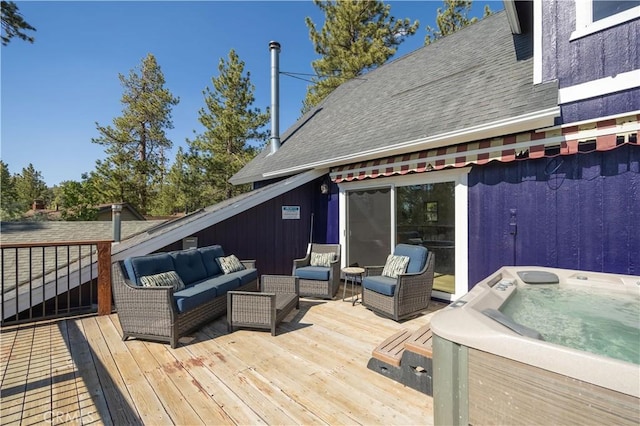 wooden terrace with a hot tub and an outdoor hangout area