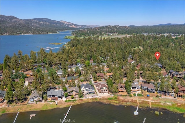 drone / aerial view featuring a water and mountain view