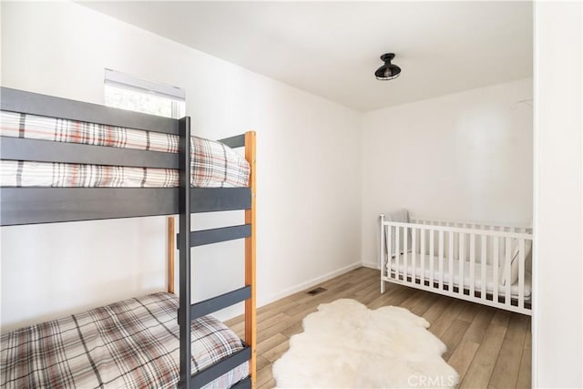 bedroom featuring hardwood / wood-style floors