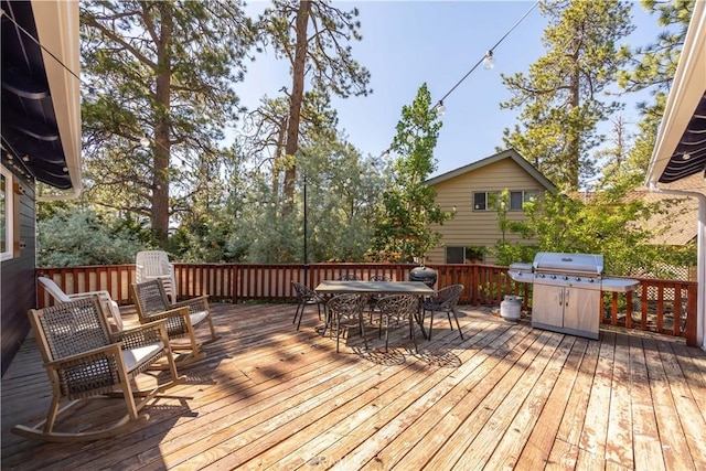 wooden terrace with area for grilling