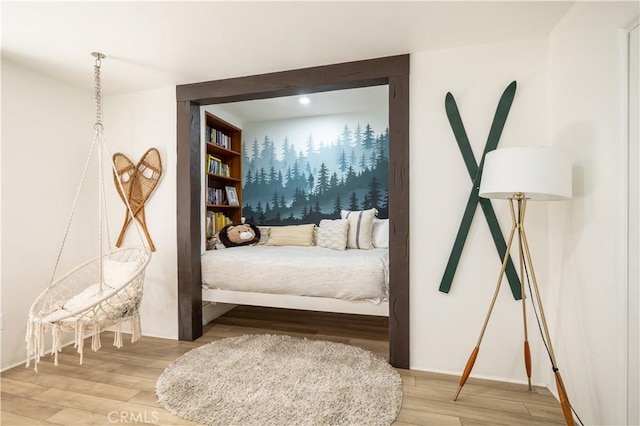 bedroom with wood-type flooring